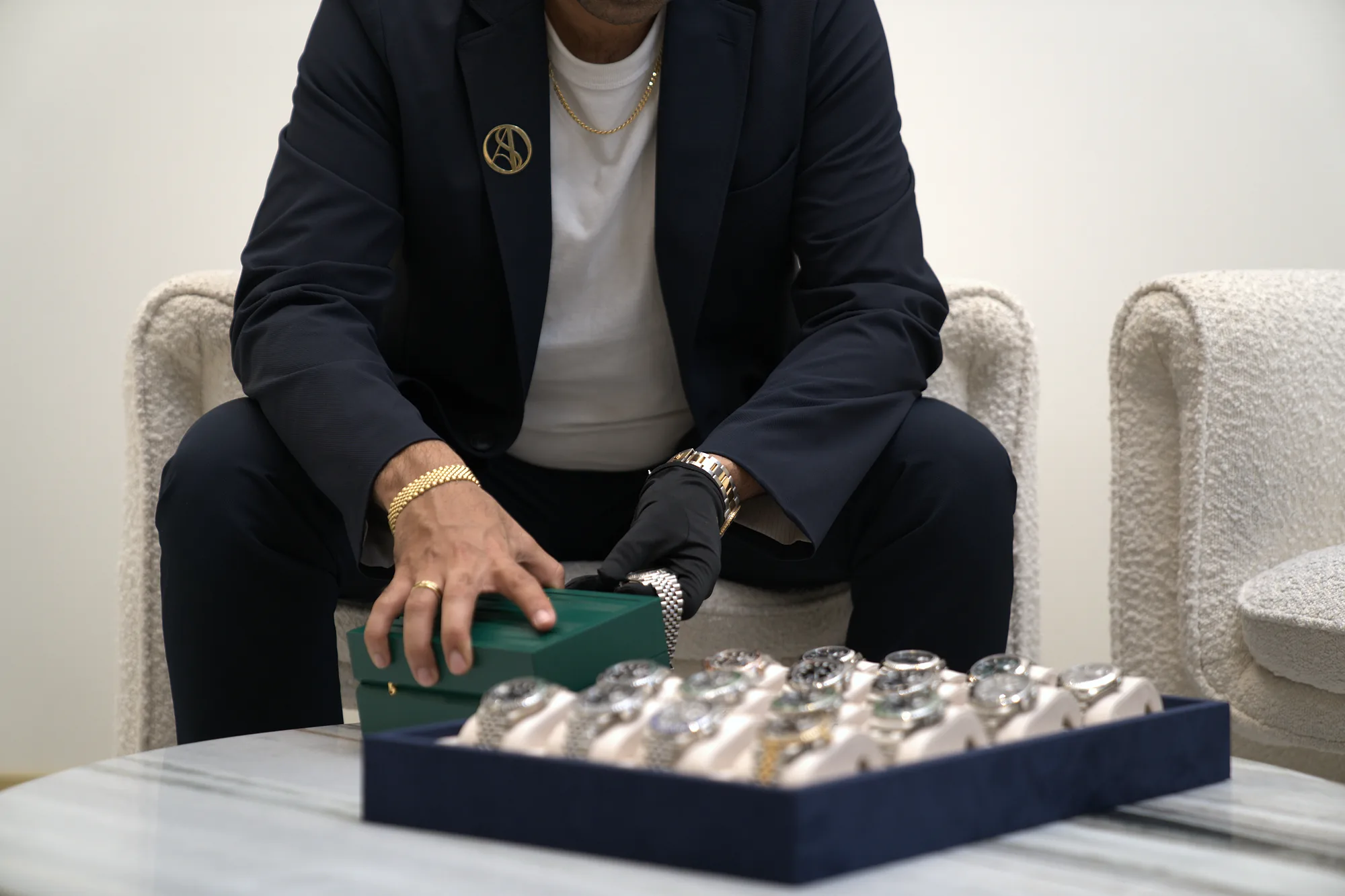 A SASO specialist with a tray of Rolex watches at the Mt Gravatt showroom